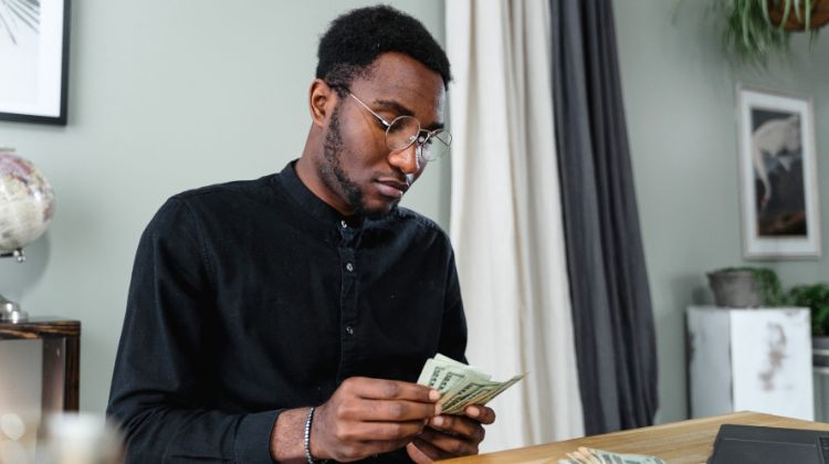 man counting money