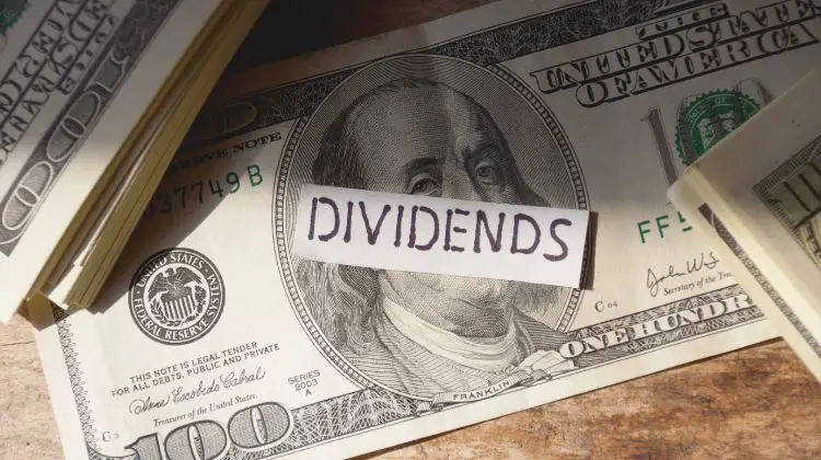 Dividends on top of a $100 bill