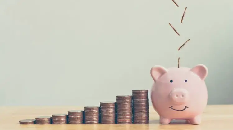 piggy bank with coins falling into them