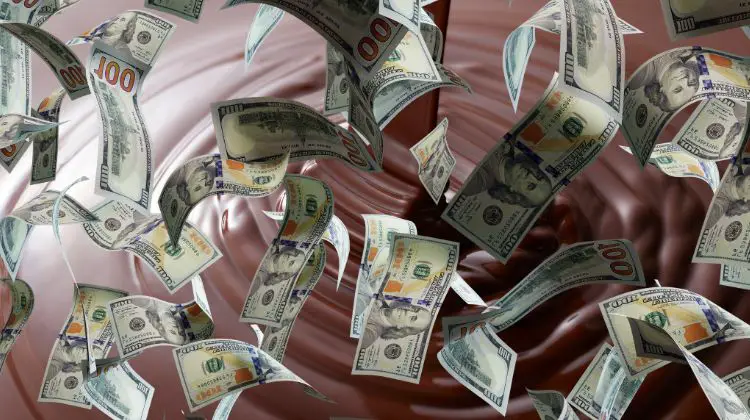melted chocolate with money falling in front of it